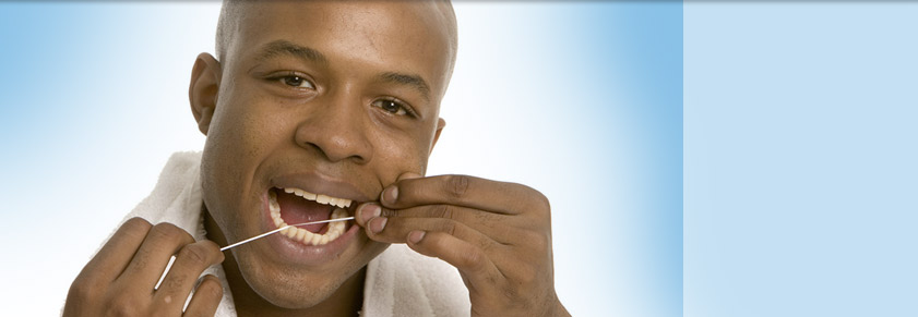 man flossing with blue background