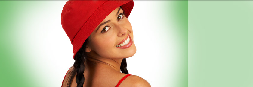 woman with red hat green background